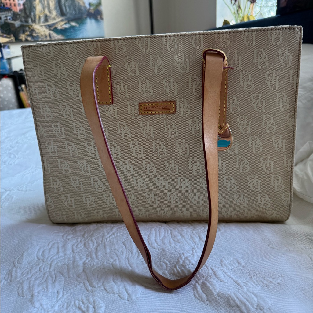 Dooney & Bourke Beige Monogram Tote With Tan Leather Straps And Gold Charm